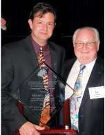 Michael Jeffress (left) poses with the CCJ Career Leadership Award with Ken McKibben, a former award recipient, at the TMC annual meeting.