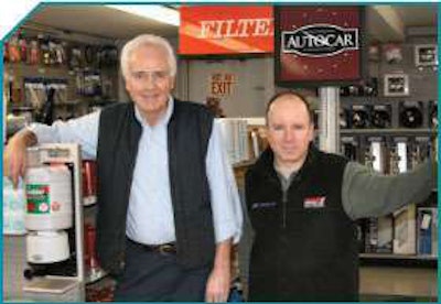 Jim Pascale (left) is president of Pascale Service Corporation, a business started by his father, Frank. Here, he and Mike Toye, the company’s parts manager, stand in the showroom of the their Pawtucket, R.I. headquarters.