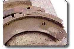 Rustjacking can slowly erode any braking system over time. As road chemicals slowly seep into brakes, they work their way between the pad and shoe table and create patches of rust, as seen in the two photos above. These patches push the two pieces apart and reduce the brake’s useful life.