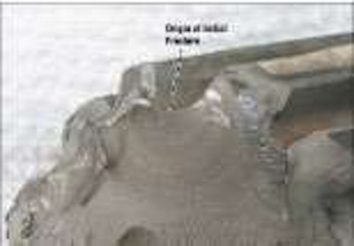 Figure 2: In this close-up of the rearward end of the fracture, you can see the fracture began at the bottom of a spline root and progressed slowly across the diameter of the shaft at a 45 degree angle.