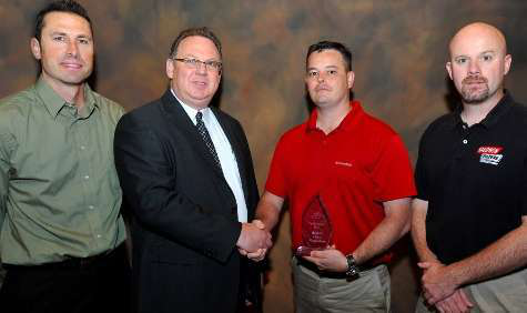 2011 Safety Spirit Award &ndash; Representatives of Baldwin Filters accept the Nebraska Safety Council Safety Spirit Award for 2011. Pictured are, from left, Brad Mailahn, Baldwin Filters assistant human resources administrator, Andy Benton, president of the Nebraska Safety Council Board of Directors, Travis Wilkins, Baldwin Filters-Gothenburg 2011 Safety Committee and Mike Richey, Baldwin Filters-Gothenburg 2012 Safety Committee coordinator.