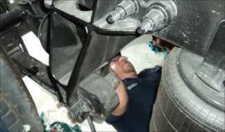 Engine oil is not the only fluid that needs to be monitored and changed during lubrication maintenance procedures. Other vehicle components, such as the gear box shown here, also require lubricants and need to be checked and refilled as necessary.