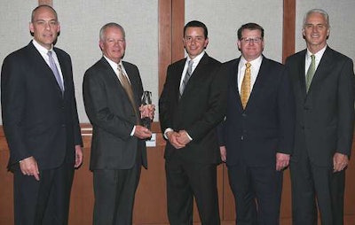Truckworx Kenworth was named Kenworth’s 2012 Parts and Service Dealer of the Year for the United States and Canada. From left, are Darrin Siver, PACCAR vice president and PACCAR Parts general manager; Truckworx Kenworth executives Bob Mitchell and Will Bruser; Tony McQuary, PACCAR Parts general sales manager; and Gary Moore, Kenworth general manager and PACCAR vice president.