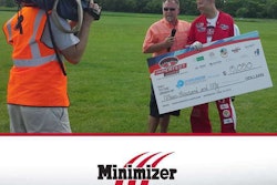 Minimizer’s Craig Kruckeberg donates a check to Kevin Burkart after his Imperfect Jumps event raised $78,000 for Parkinson’s disease patient care and research.