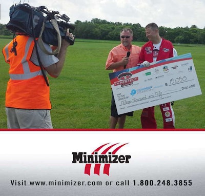 Minimizer’s Craig Kruckeberg donates a check to Kevin Burkart after his Imperfect Jumps event raised $78,000 for Parkinson’s disease patient care and research.