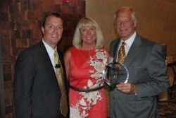 Randall-Reilly President Brent Reilly presented TEC Equipment’s Ann Thompson and David Thompson with the inaugural Successful Dealer Award Wednesday night.