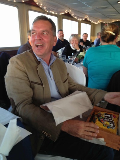 Stefan Kurschner was presented with a gift of appreciation from his DMR Electronics employees Wednesday.
