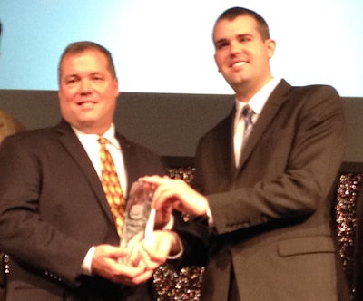 Truck Parts & Service Editor Lucas Deal (right) presents the Distributor of the Year award to Ed Neeley, owner of Truck Supply Co. of South Carolina.