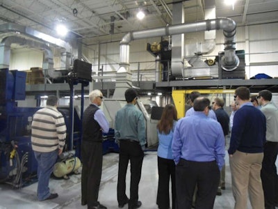 Students gather for a dynamometer presentation during a previous TMD Friction training course.