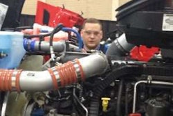 Brian Smith, a technician with Rush Enterprises, gets eye-level in his work.