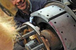 Men looking at wheel end