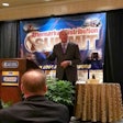 Sam Wyche speaks to the crowd at the CVSN Aftermarket Distribution Summit Monday in Nashville.