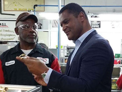 PSI Team Leader Horace Williams with Assistant Secretary of Commerce Marcus Jadotte during the latter’s visit to PSI on June 8, 2015.
