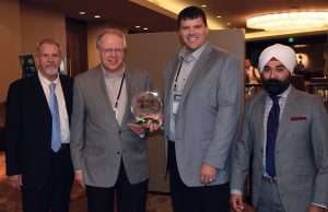 Pictured, from left to right, are Automann USA National Sales Manager Danny Ferrell, Freightliner of St. Cloud CIC Pat Miller and GM Jon Pearson, and Automann USA Vice President Jeev Khanduja.