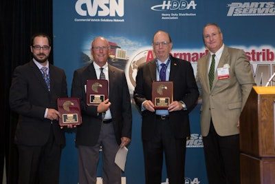 From left: Ian Johnston, Dave Scheer and Marc Karon are presented plaques by CVSN President Dave Willis for their efforts in helping to create a heavy-duty access to repair information MOU.