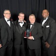 Meritor’s Marty Hetherington, Gene Evans, Tim Bauer and Keith Evans accepting the Spirit Award at last month’s banquet.