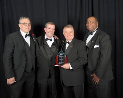 Meritor’s Marty Hetherington, Gene Evans, Tim Bauer and Keith Evans accepting the Spirit Award at last month’s banquet.