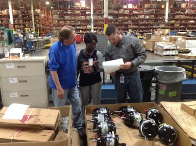Brandon Woodard (right), second shift facilitator, Value Added Services, at Meritor, speaks with his team members on May 18 at Meritor’s Aftermarket Distribution Center in Florence, Ky. An Army combat veteran, Woodard is the first Wyakin Warrior alum to be hired in the heavy-duty aftermarket.