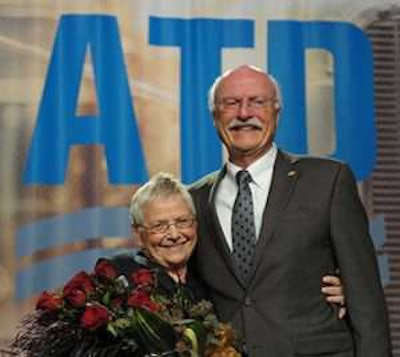 Sharon Nuss (left) joins her husband on stage after he was named 2017 Truck Dealer of the Year at the ATD convention in New Orleans. Photo courtesy ATD.