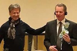 Alarico Asuncion Junior (left), president of FENABRAVE, presents Kyle Treadway, president of Kenworth Sales Company in Salt Lake City, with a gift on March 16, 2017.