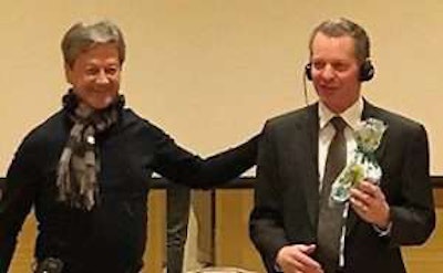 Alarico Asuncion Junior (left), president of FENABRAVE, presents Kyle Treadway, president of Kenworth Sales Company in Salt Lake City, with a gift on March 16, 2017.