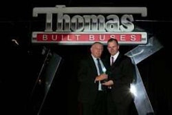 Thomas Bus Sales of Georgia General Manager Ken Lane (pictured left) receives Platinum Club dealership award from Thomas Built Buses CEO Caley Edgerly during the Thomas Bus Dealer Meeting in Dallas, Texas on April 1, 2017.