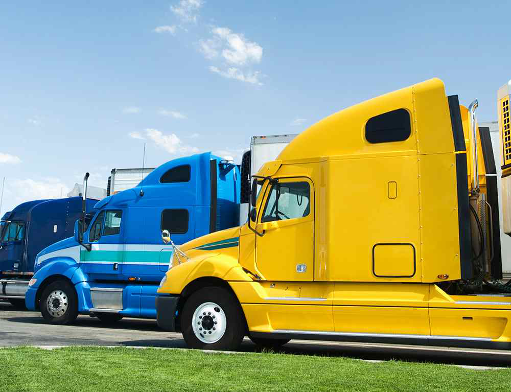 Multiple semi trucks parked