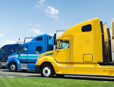 Multiple semi trucks parked