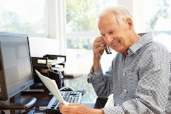 Old Man Handling a Phone Sales Inquiry