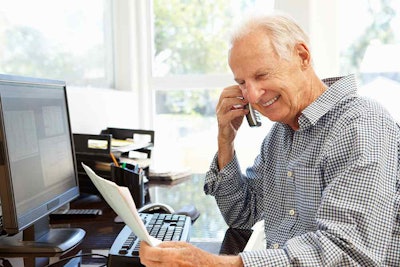 Old Man Handling a Phone Sales Inquiry