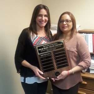 Palm Isuzu Truck Centers of Fort Pierce, Fla receiving award