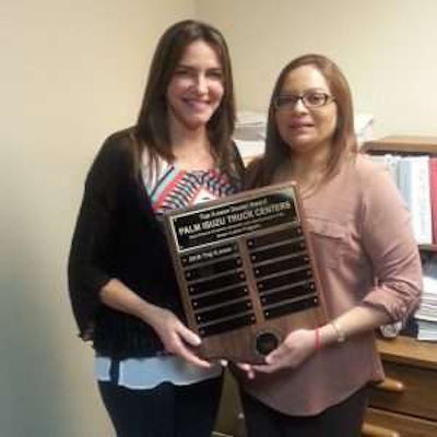 Palm Isuzu Truck Centers of Fort Pierce, Fla receiving award