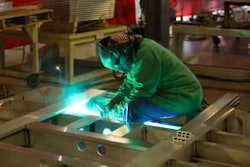 Employee welding at a plant facility