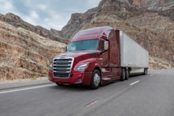 freightliner truck on the highway with red cab and white trailer