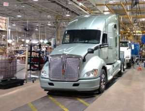 Kenworth truck on the floor of a plant