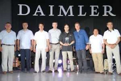 Horton employees on the Daimler stage being honored