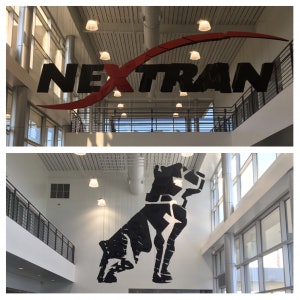 A large work of 3D art greets visitors to Nextran’s Atlanta site. From one end of the store, it shows the Nextran logo. From the other end, the Mack bulldog.