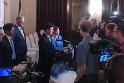 Davey Jung, executive vice president at Hino Motors Manufacturing U.S.A., answers questions from the media Wednesday at press conference in West Virginia.