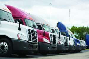 Parking Lot Full of Semi-Trucks