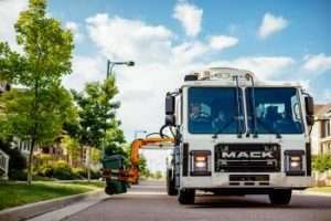 Mack Dump Truck Picking Up Trash