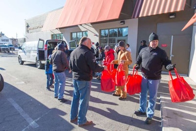 Tri State Truck Center Employees Hands Out Snacks