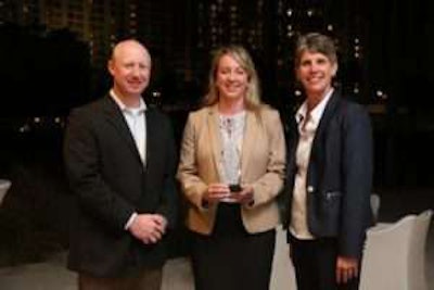Eganne Wolfington of Wolfington Body Company accepts the 2017 IC Dealer of the Year award. She is flanked from left to right by Ryan Kauffman (vice president of sales, IC Bus) and Trish Reed (general manager and vice president, IC Bus).