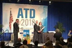 Richard Reynolds, president and dealer principal at Peach State Truck Centers, accepts the 2018 ATD Dealer of the Year award at ATD Show 2018 in Las Vegas.