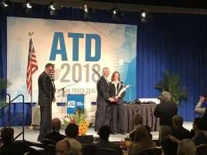 Richard Reynolds, president and dealer principal at Peach State Truck Centers, accepts the 2018 ATD Dealer of the Year award at ATD Show 2018 in Las Vegas.