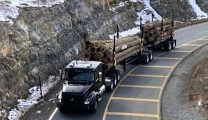 Volvo VNL Hauling Logs