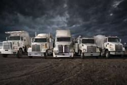 5 Western Star Trucks parked