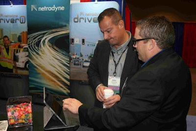 John Elliott, CEO of Load One, receives a demo of Netradyne’s new RiskMap feature during the TCA conference from Adam Kahn.