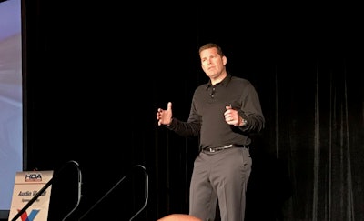 Alden Mills speaks Thursday at the HDA Truck Pride Annual Membership Meeting in San Diego.