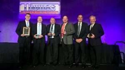 The Thomas Bus Sales of Georgia team poses with awards during the Thomas Built Buses Dealer Meeting in Orlando.