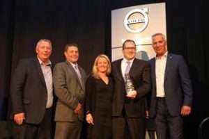 S&S Volvo Dealer Principal Todd Schaub (right of center) and wife Lynn Schaub (center) receive the award for the 2017 Volvo Trucks North American Dealer of the Year from (left to right) Bruce Kurtt, senior vice president of sales for Volvo Trucks North America; Chris Gossler, regional vice president northeast U.S. region; and Göran Nyberg, president of Volvo Trucks North America.